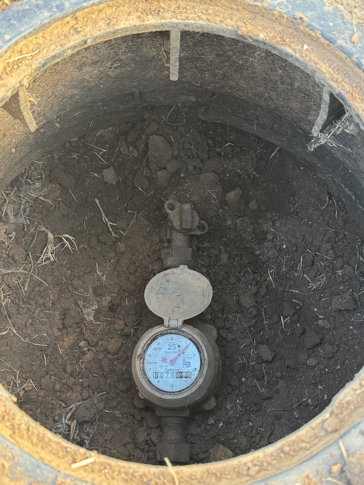 Street / curb water shutoff — meter and valve inside the curb box